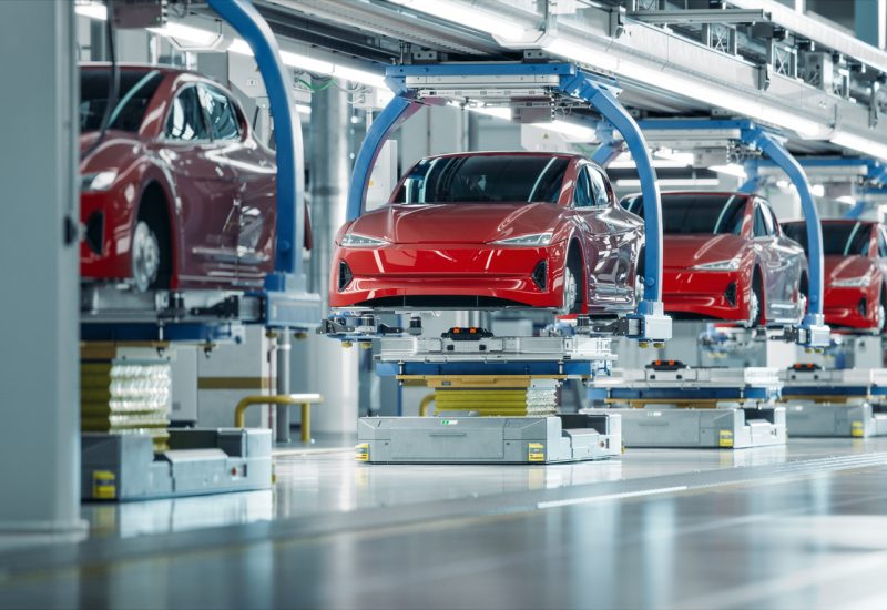 EV Production Line on Advanced Automated Smart Factory. High Performance Electric Car Manufacturing. Car Batteries Installation on Electric Vehicles on Assembly line. Automotive Plant.