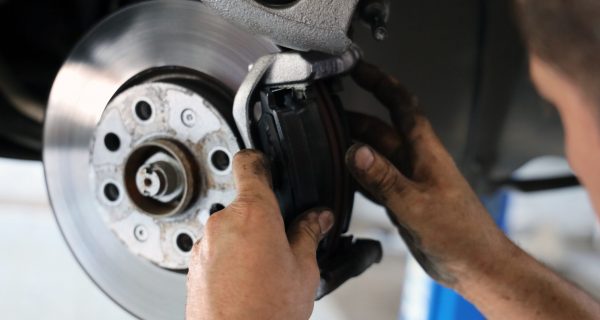 Brake pad replacement in car service